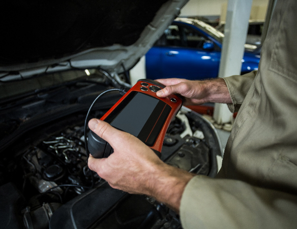 Mechanic using Diagnostic Tool