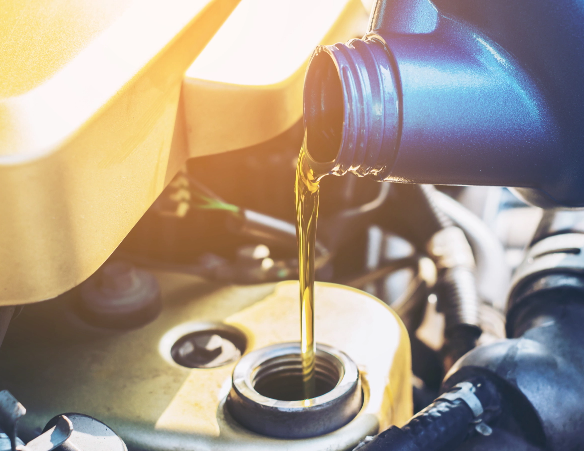 Pouring Oil into Car Engine
