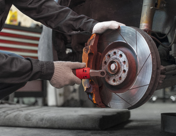 Worker Repairing Car